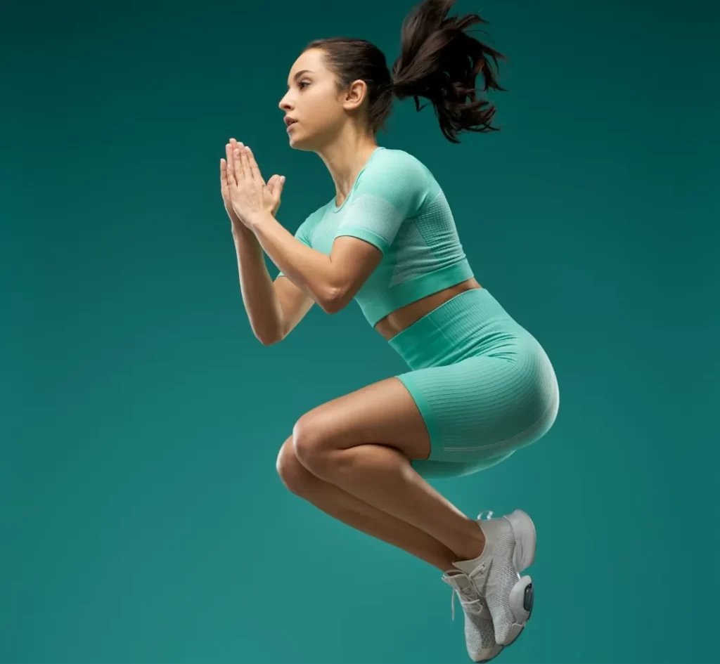 charming young woman in sportswear jumping in the utc